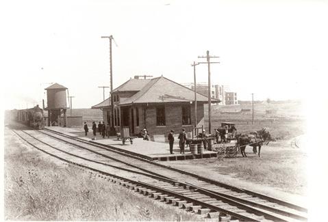 The Wabash Train Depot with the new Fifth District Normal School in the background. Maryville's two railroads helped provide a tangible inducement to the State Normal School Committee.