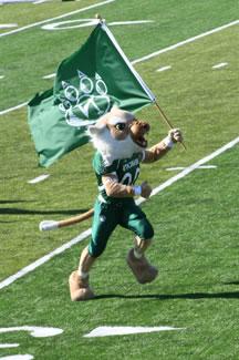 Bobby runs down Mel Tjeerdsma Field waving his flag to a cheering crowd of spectators during the 2007 Homecoming Football Game.